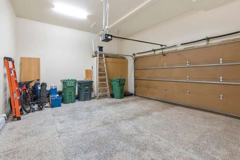 The heated double garage makes vehicle access easy. Although, the free dial-a-ride car service for