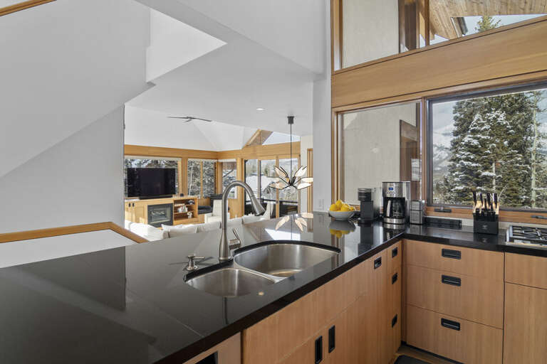 High ceilings, natural light and stunning views make this kitchen the most beautiful place for preparing a meal.
