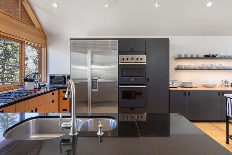 Plenty of pantry space, double oven for baking, microwave, Family size stainless steel refrigerator.