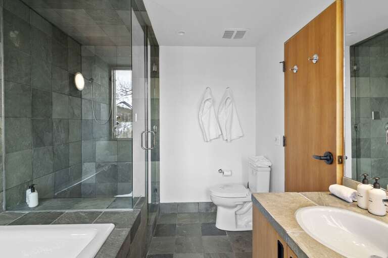 The Primary bathroom features a large soaking tub as well as a step in shower.