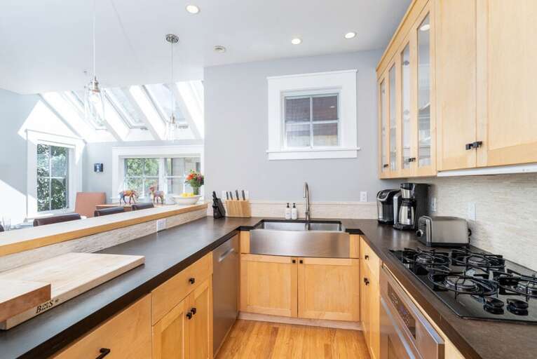 Chef's kitchen with generous counter space, perfect for cooking, hosting friends, and gathering with family—fully equipped for all your culinary needs.