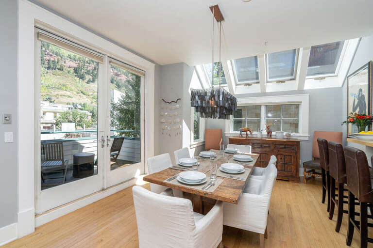 Deck area off dining room with seats for 2 and a gas grill. Deck area off dining room with seats for 2 and a gas grill.