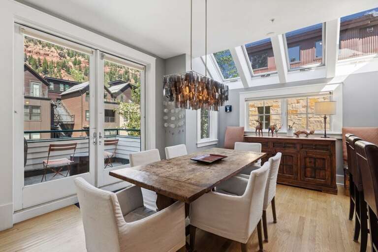 Dining with access to private deck great light from skylights.