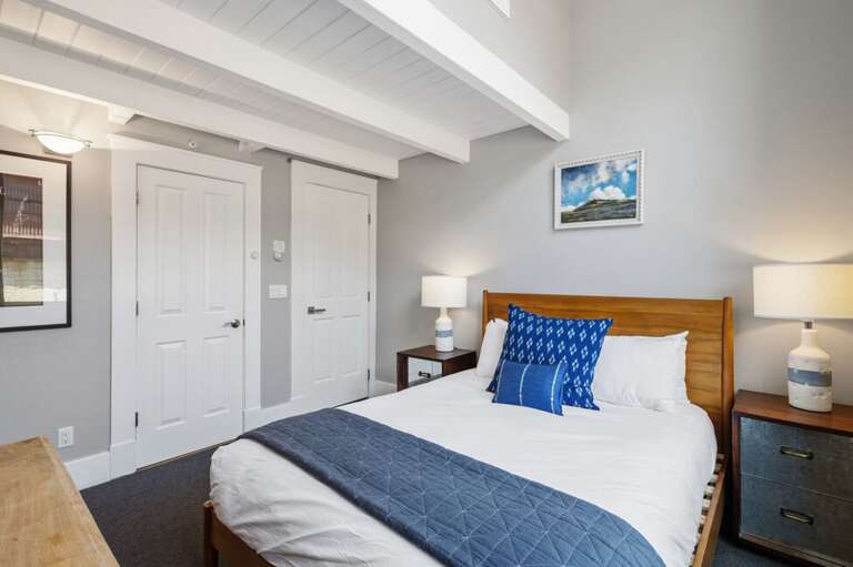 Guest queen bedroom with closets.