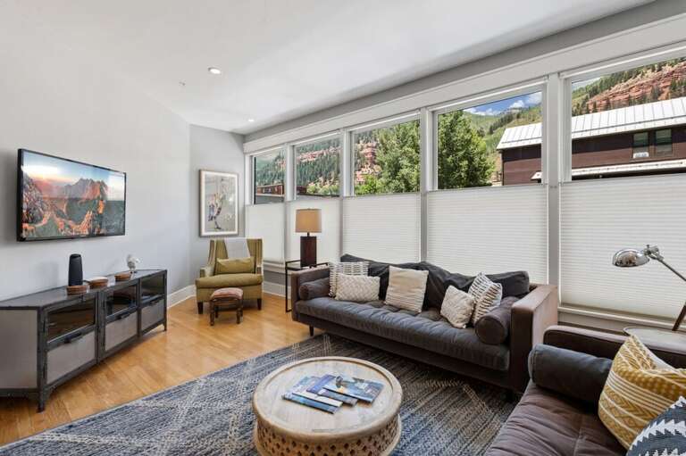 Lots of windows in living room making it a bright inviting space.