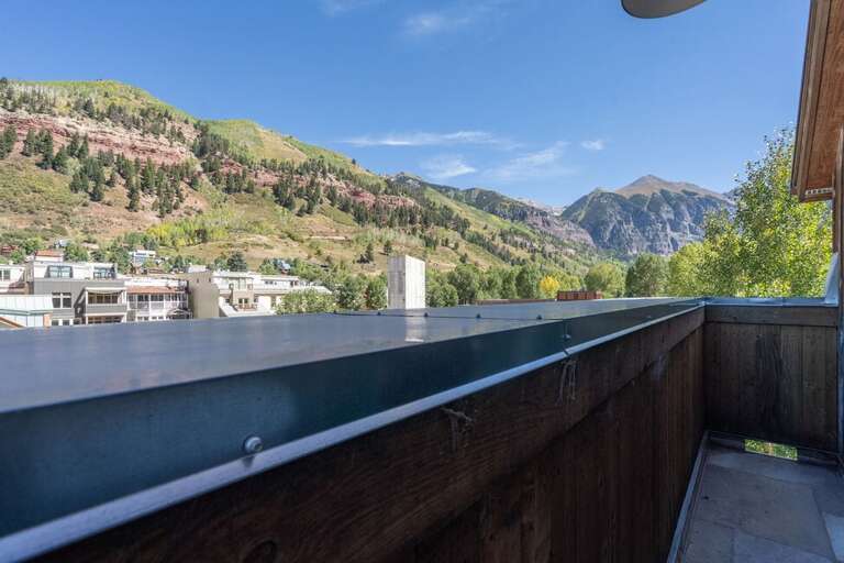 Primary bedroom features a personal deck looking onto the mountains. Primary bedroom features a personal deck looking onto the mountains.