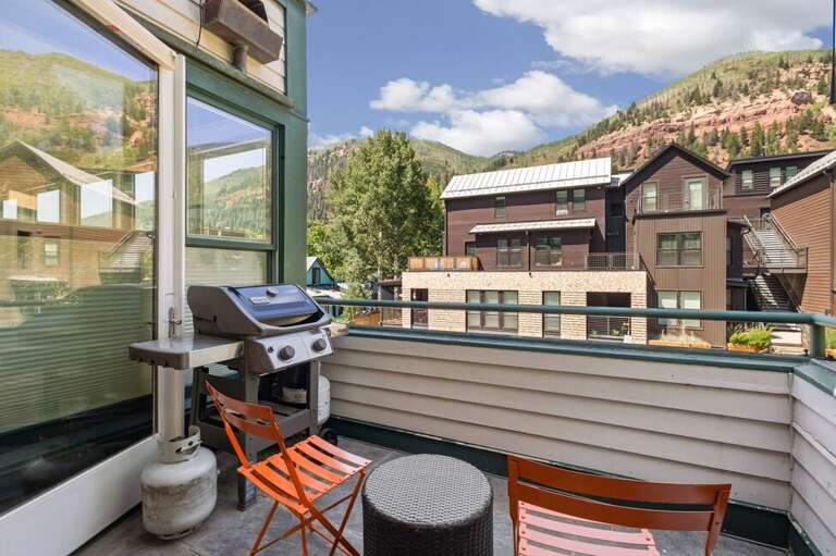 Private balcony off the dining area offering fresh mountain air and serene scenery.