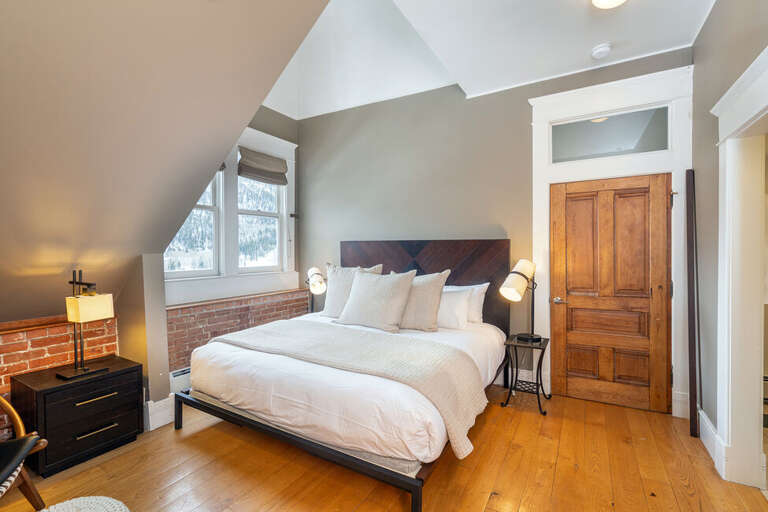 The Primary suite is located on the first level of the condo.  Features a King Bed and ensuite bathroom with large spacious closet.