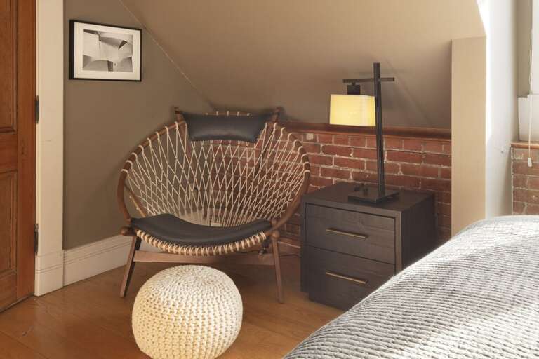 Reading area in the primary bedroom for relaxing after a great day exploring.