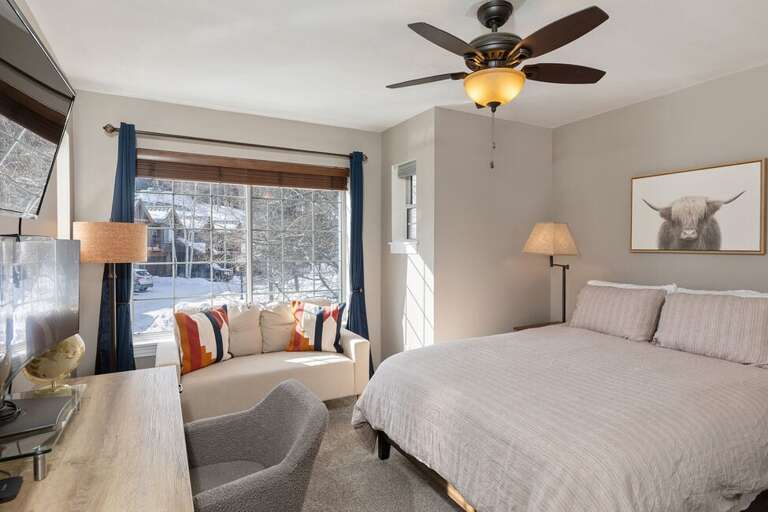 Guest Room two features a Queen bed, desk area as well as love seat with perfect views to the mountains.