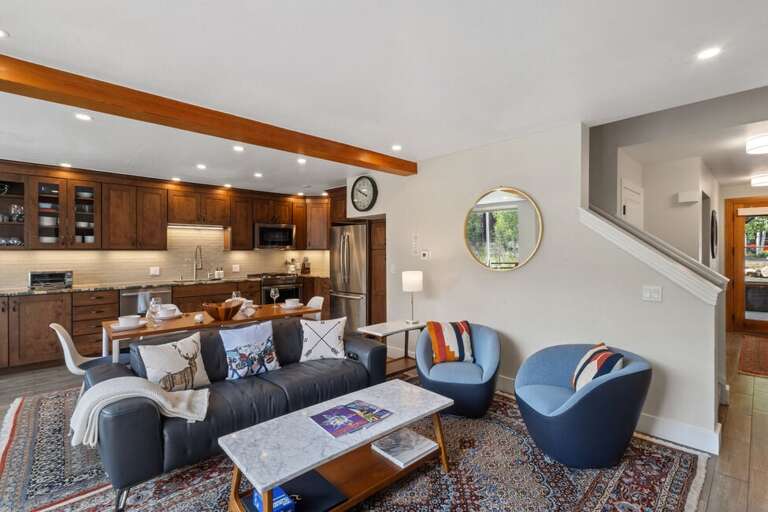 The first level opens up to a large living room, kitchen and spacious deck with plenty of natural light and a gas fireplace. The first level opens up to a large living room, kitchen and spacious deck with plenty of natural light and a gas fireplace.