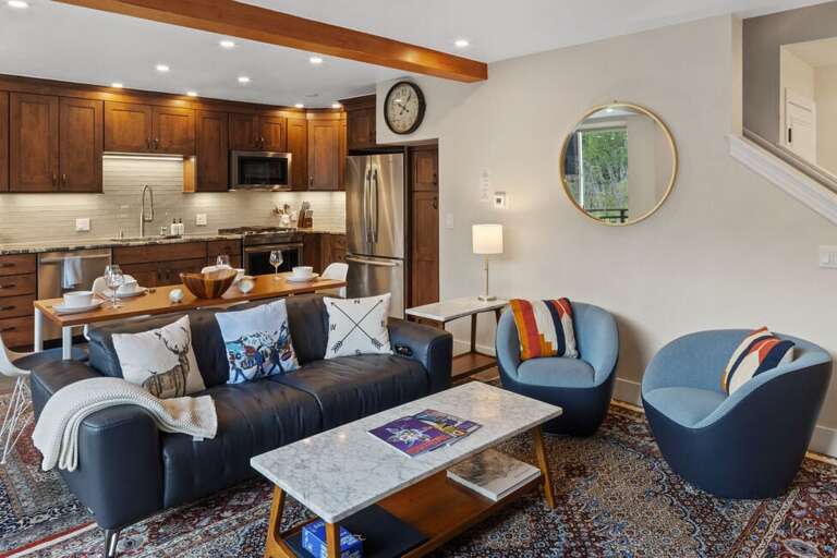 The first level opens up to a large living room, kitchen and spacious deck with plenty of natural light and a gas fireplace.