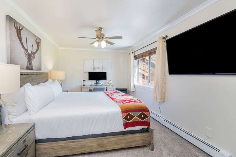 Primary King Bedroom with wall mounted Television, ensuite bathroom. All the Bedrooms are located on the Second level of this home. Primary King Bedroom with wall mounted Television, ensuite bathroom. All the Bedrooms are located on the Second level of this home.