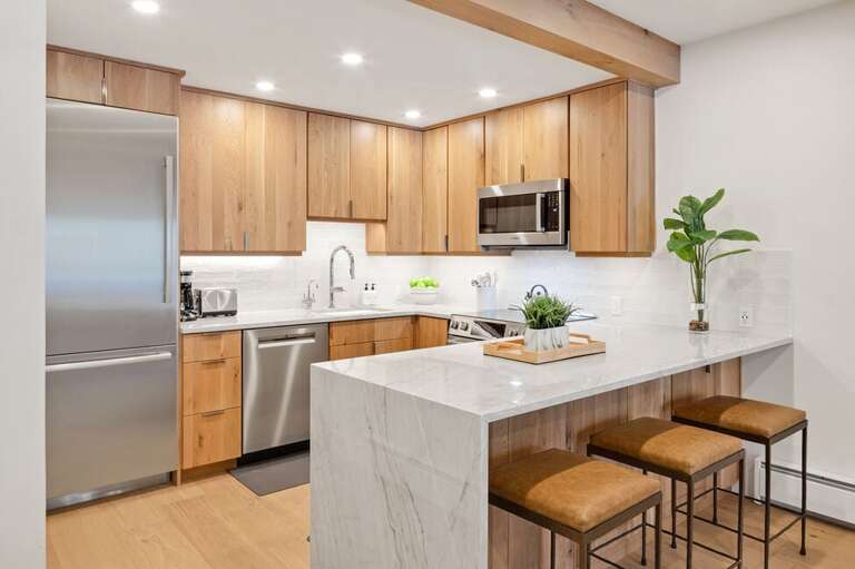 Beautiful modern kitchen with stainless appliances.