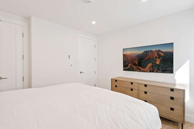 Cozy guest room with plenty of natural light.