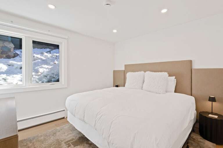 This guest room features a versatile king bed that can be converted into two twin beds upon request.