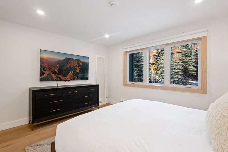 The primary offers stunning views with natural light and river sounds.