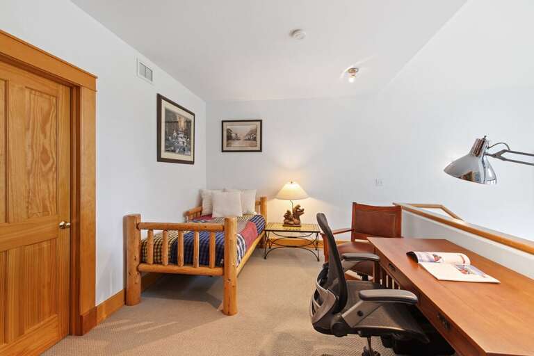 Second floor landing features a office/desk space for gettin work done as well as a single bed for reading a good book or taking a nap after a fun day exploring.