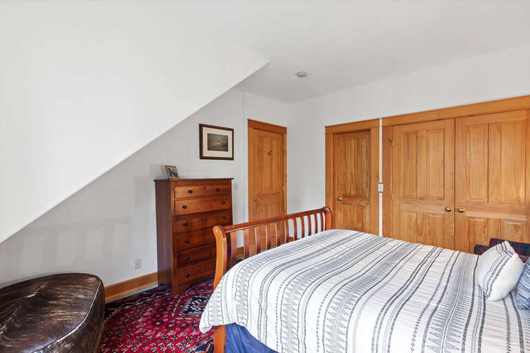 This guest room features an attached shared powder room. This guest room features an attached shared powder room.