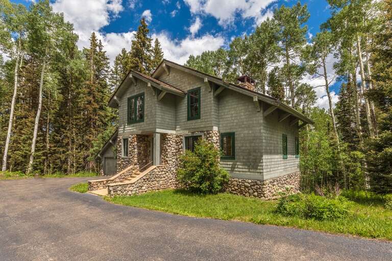 Located in a quiet neighborhood, This beautiful Mountain home features plenty of parking for a few vehicles as well as a two car garage.