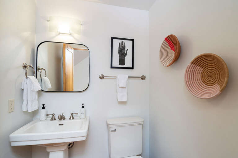 Powder Room located off the kitchen and living area. Powder Room located off the kitchen and living area.