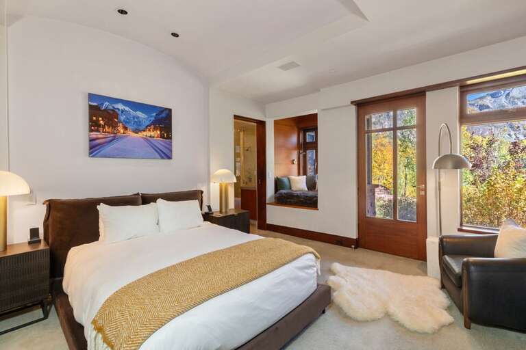 Guest queen bedroom, this room features a smart bed plus dedicated workspace with incredible mountain views.