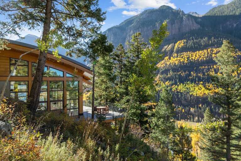 Huge porch space surrounds this stunning home on all levels.