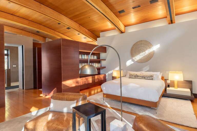 Primary king bedroom, has a  private patio and awe-inspiring views of the surrounding mountains.