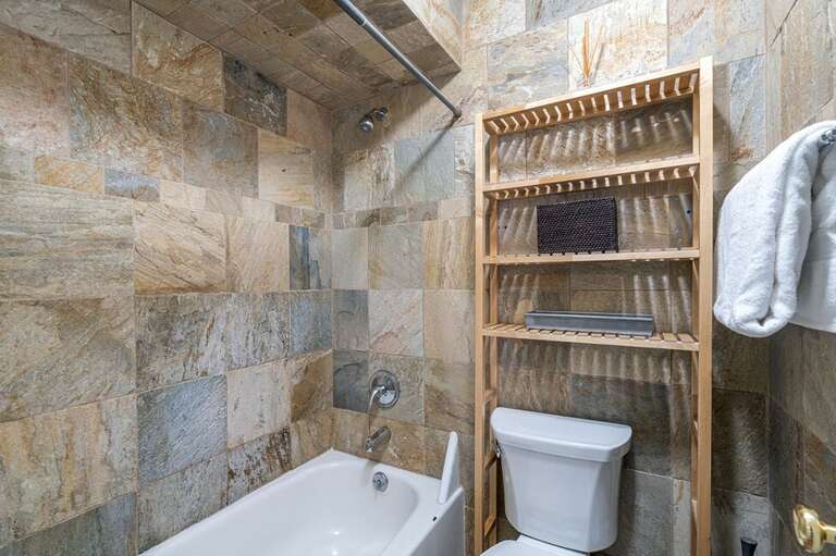 Bathroom features a large step in shower/tub combo. Bathroom features a large step in shower/tub combo.