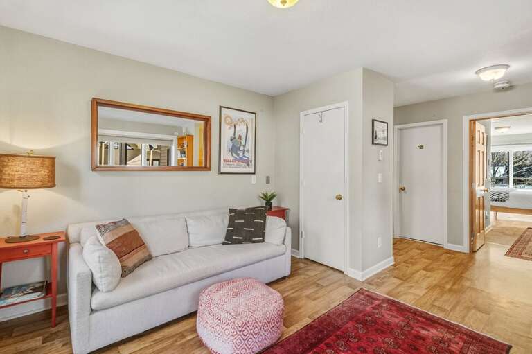 Cozy living area as you enter the condo perfect for family games and chilling after a fun day.