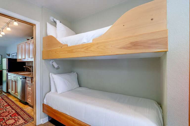 Double bunks located in hallway connecting the living area to the Kitchen area. Double bunks located in hallway connecting the living area to the Kitchen area.