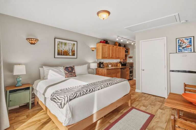 This Unit Features a Kind Size bed in the Primary Sleeping area with views of the surrounding mountains.