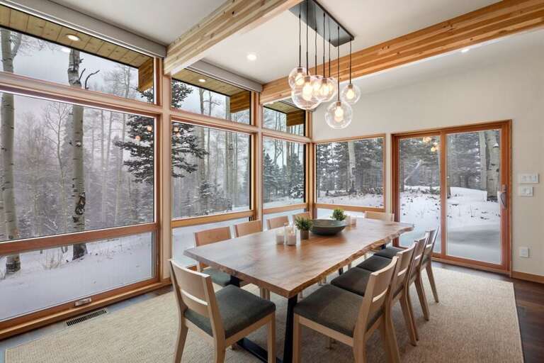 Dining for 10 with a view of Beautiful Aspen Grove surrounding the house. Dining for 10 with a view of Beautiful Aspen Grove surrounding the house.