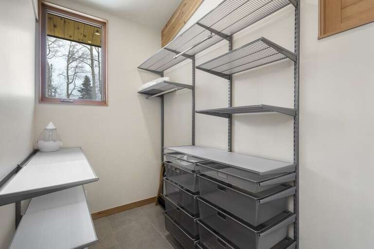 This huge walk in closet in the primary suite allows storage for all you r items. This huge walk in closet in the primary suite allows storage for all you r items.