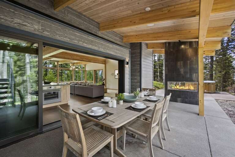 Outdoor dining area with Gas fireplace and Grill. Outdoor dining area with Gas fireplace and Grill.