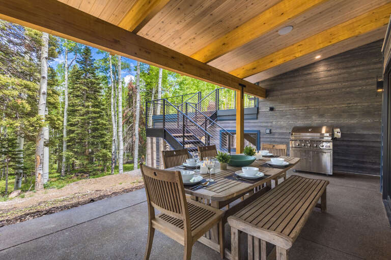 Outdoor dining/grilling area with hot tub and gas fireplace. Outdoor dining/grilling area with hot tub and gas fireplace.