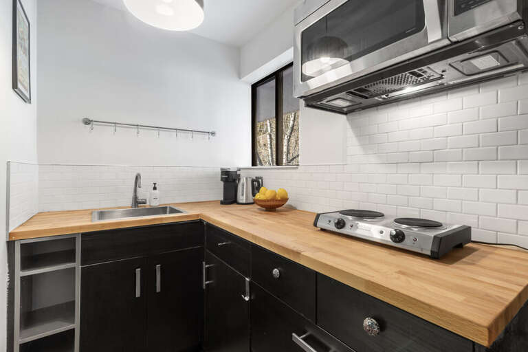 Ample counter space, plenty of storage for personal items with bright natural light.