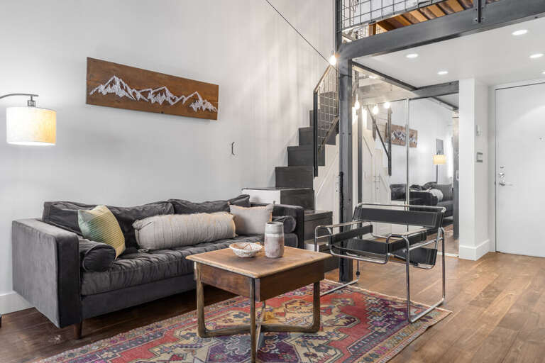 High ceiling, modern decor cozy studio condo perfect for two.