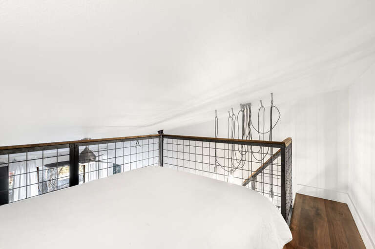 This unit features an open loft with Queen bed overlooking the dining and living area.