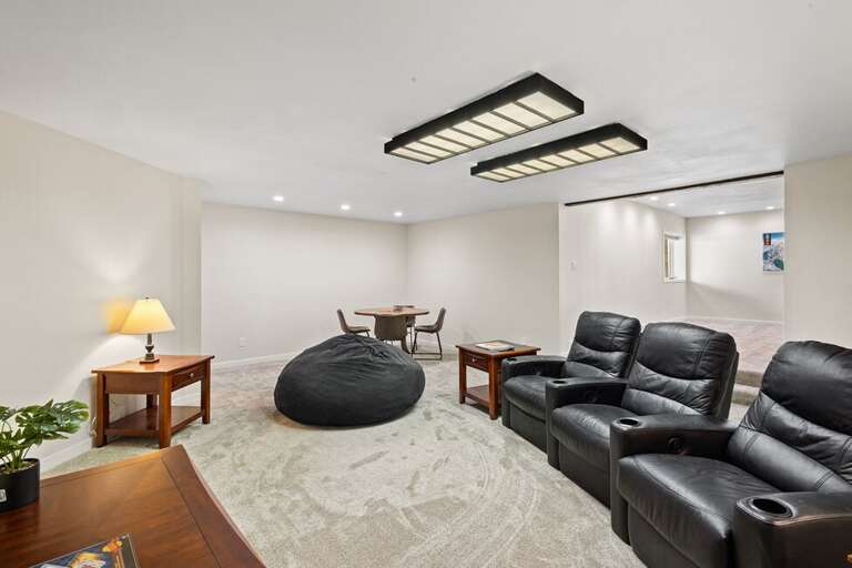 The basement features a media/game/bar area perfect for family time.