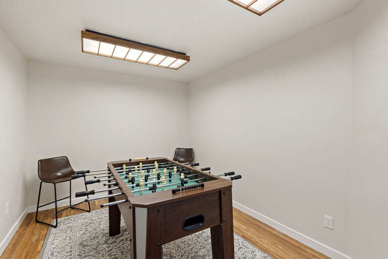 Challenge someone to a foosball game.