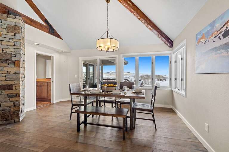 The dining area seats 6+ and overlooks the living area and offers access to the deck area.