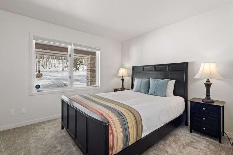 Entry level guest room features a Queen size bed