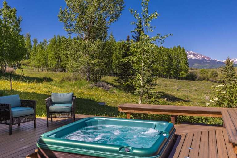This home features stunning views with a multi-level deck featuring outdoor seating/dining, hot tub, gas grill and a huge open backyard. This home features stunning views with a multi-level deck featuring outdoor seating/dining, hot tub, gas grill and a huge open backyard.