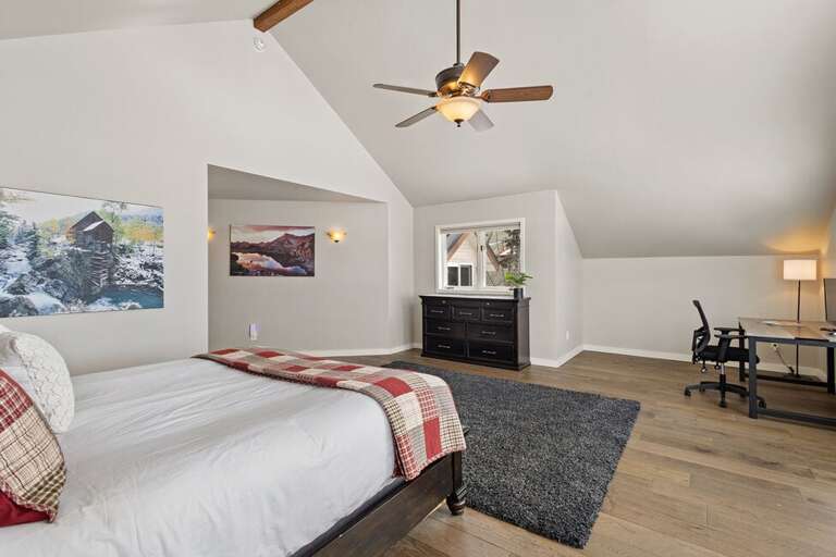 Primary Suite features California King and is located on the top level of this spacious home.