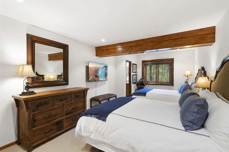 Bottom level Guest  room with ensuite bathroom and 2 Queen beds.