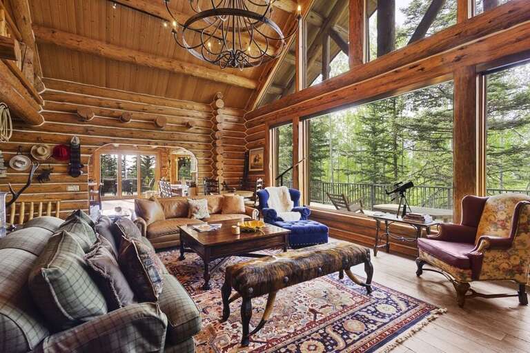 Cozy great room with stunning views is the perfect place to enjoy family time in front of the wood burning fireplace.