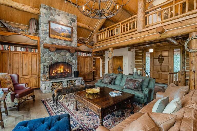 Enter into a stunning great room with high ceilings and wood burning Fireplace.