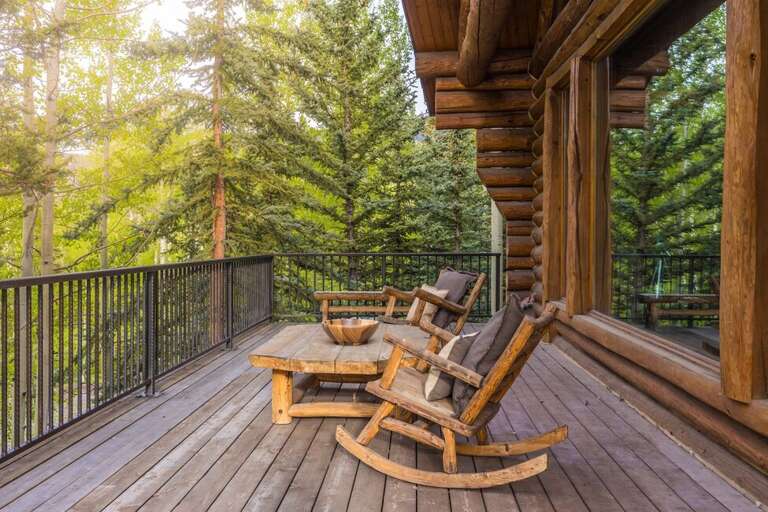 This home features an incredible deck with beautiful views, outdoor dining and hot tub.