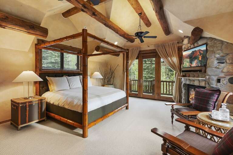 The master suite encompasses the top level of this charming home and features spa like bathroom, office and private deck.